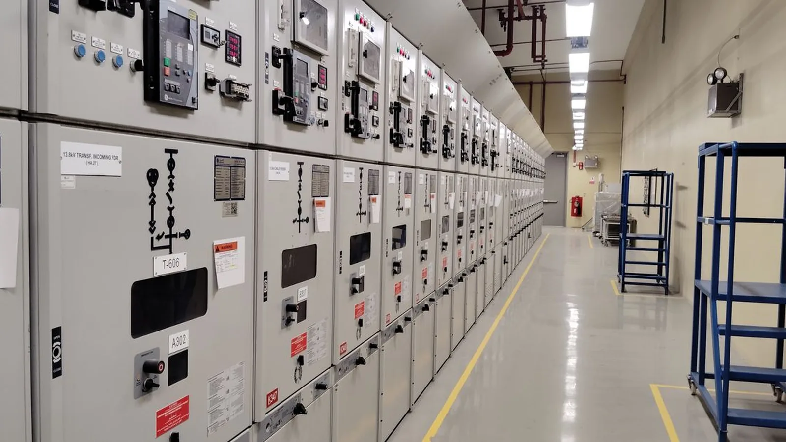Omron system integrator commissioning an NX controller and NB HMI in Saudi Arabia